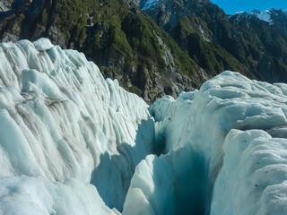Deep crevasse cuts through ice of Franz Josef Glacier, Westland Tai Poutini National Park, South...