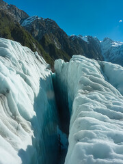 Deep crevasse cuts through ice of Franz Josef Glacier, Westland Tai Poutini National Park, South...