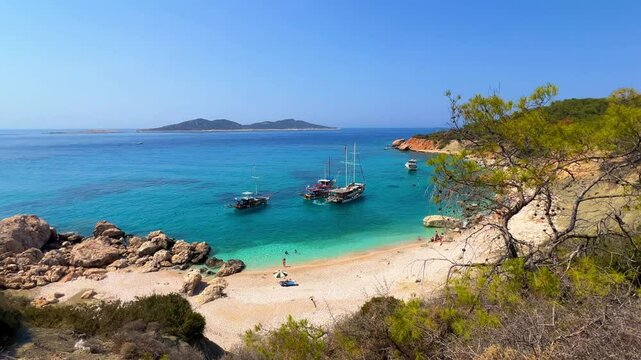 Soguk Su Koyu, Cold Water Bay, is a beach in Turkey located in the Fethiye district of Mugla Province. It is surrounded by mountains, vegetation, and has blue water. The beach is lined with yachts.4К