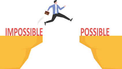 A painter stands on a stepladder and hides the word Impossible written on the wall using a white paint roller. Business and success. Goals and planning. Impossible made possible.
