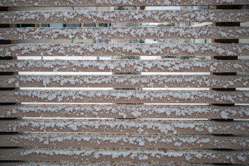 frosty wooden fence with horizontal planks