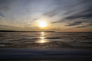 Fototapeta premium winter sunshine above the frozen sea in Oulu, Finland