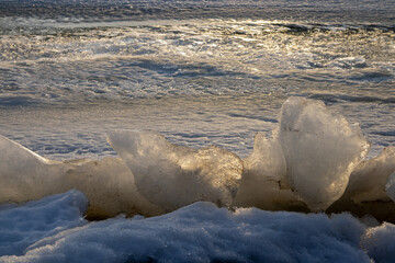 blocks of ice on sea shore