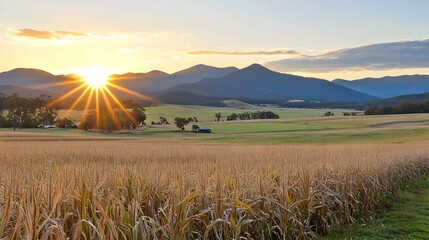 Sunrise over rural farmland, mountains in background; idyllic pastoral scene, perfect for travel brochures