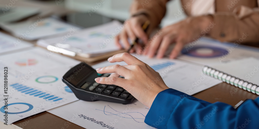 Poster accountants collaborating on financial reports using a calculator and charts