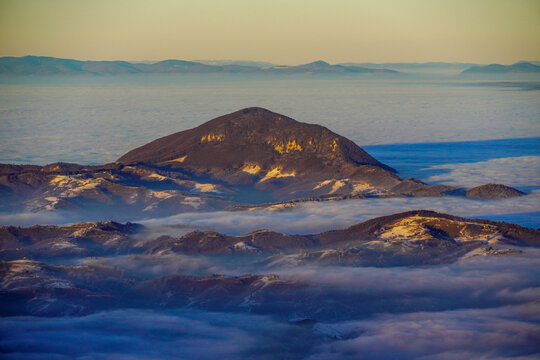 sunset over the sea, Magura Codlei Peak, Persani Mountains, Romania. Viewpoint from Piatra Mica Peak.