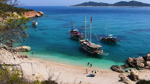 Soguk Su Koyu, Cold Water Bay, is a beach in Turkey located in the Fethiye district of Mugla Province. It is surrounded by mountains, vegetation, and has blue water. The beach is lined with yachts.4К