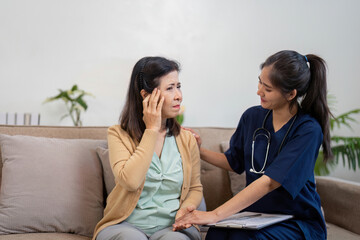 Caregiver comforting elderly patient experiencing symptoms of disease, providing support and reassurance