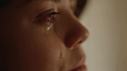 Emotional Close-Up of a Person Shedding Tears in a Quiet Moment of Reflection