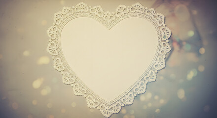 A romantic heart-shaped frame with intricate lace details.