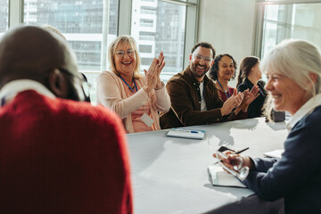 Successful colleagues at a happy business meeting exhibiting teamwork