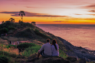 Background of young couples or solo travelers watching the natural light of the sunset at the...