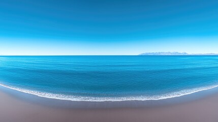 Fototapeta premium Serene beach, azure ocean, distant mountains, calm waves; perfect for travel brochures