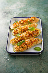 Baked zucchini with chicken and herbs