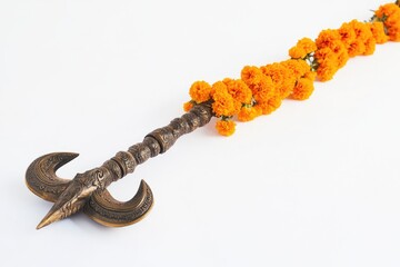 Fototapeta premium A close-up of a unique sword with vibrant orange flowers attached to the handle