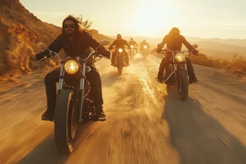 Bikers riding on dusty road at sunset