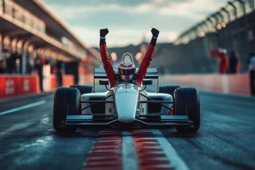 Naadloos Fotobehang Airtex Formula one pilot celebrating victory raising arms inside his car © Gatherina