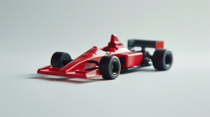 A small toy racing car on a white background with natural lighting.