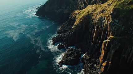 Dramatic coastal cliffs, ocean waves crashing, aerial view, travel background