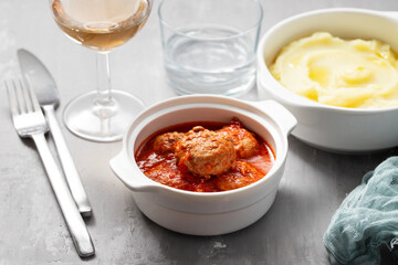 Homemade meatballs with sauce in bowl and mashed potato