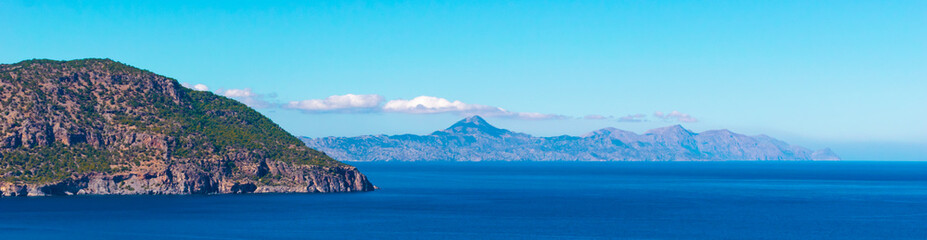 Panoramic view of north part of Karpathos island with mountains in the distance, Greece © Anyarnia