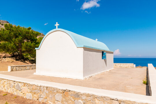 Small Chapel above Achata Beach with view of Aegean Sea in Karpathos Island, Greece