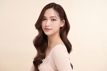 Fototapeta premium Beautiful young asian woman with clean fresh skin on beige background, Face care, Facial treatment, Cosmetology, beauty and spa, Asian women portrait.