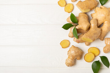 Fresh ginger on wooden background. Dry ginger. Sliced ​​ginger with honey and lemon. Ginger...