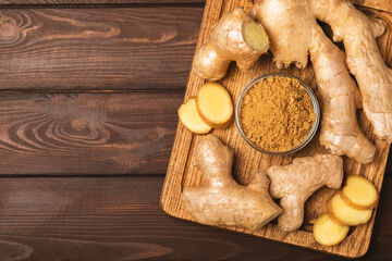 Fresh ginger on wooden background. Dry ginger. Sliced ​​ginger with honey and lemon. Ginger...