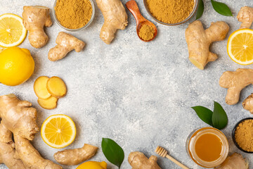Fresh ginger on wooden background. Dry ginger. Sliced ​​ginger with honey and lemon. Ginger...