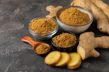 Fresh ginger on wooden background. Dry ginger. Sliced ​​ginger with honey and lemon. Ginger...
