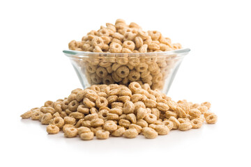 Sweet honey cereal rings in bowl isolated on white background.
