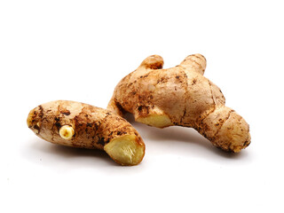 A ginger root or jahe placed on a white background. Ginger Known for its strong aromatic scent and...