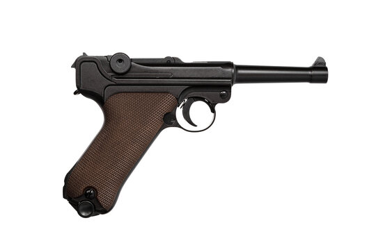 A classic Luger P08 pistol, a semi-automatic firearm known for its distinctive design and historical significance, often associated with World War I and II, isolated on a white back