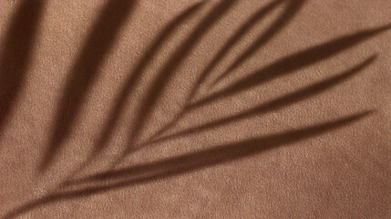 Dark brown velvet fabric background with soft leaf shadows for moody and elegant designs. Minimal backdrop, trendy copy space