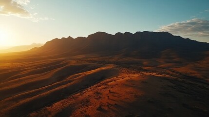 Fototapeta premium Sunset over desert mountains, aerial view, landscape photography for travel brochures