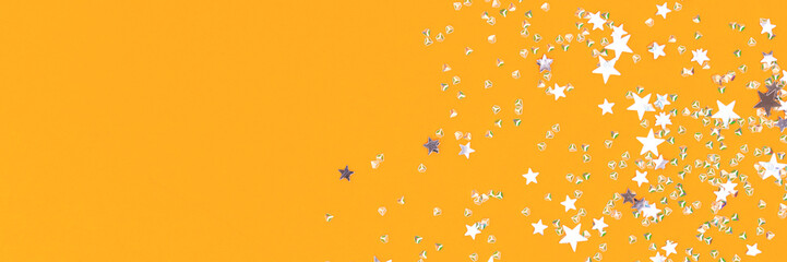 Banner with silver confetti on a yellow background.