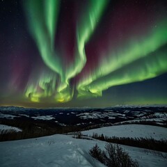 The Aurora in the sky above the hills at night.