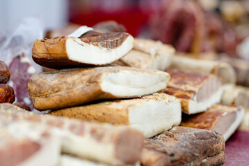 Selection of assorted home made meats, jerky and sausages on a farmers market in Vilnius, Lithuania. Kaziukas, traditional fair in capital of Lithuania.