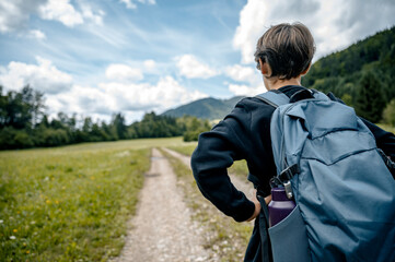 Young explorer on a scenic trail