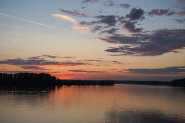 Fototapeta premium Beautiful, colorful, relaxing and amazing sunset. Sky before sunrise over river and forest. High quality photo