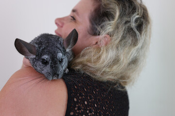 People care for and play with chinchillas.