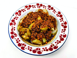Homemade peanut lontong with a combination of various ingredients such as peanuts, pineapple,...