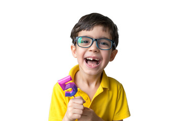 Portrait of happy five-year-old child with candle number five. Celebrate 5th Happy birthday. Party. Boy in glasses