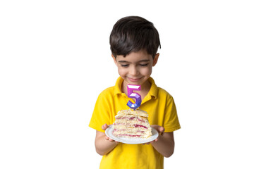 Portrait of happy five year old child with a birthday cake. Celebrate fifth Happy birthday. Party. Happy family concept, five years.