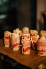 Bacon rolls on a baking sheet