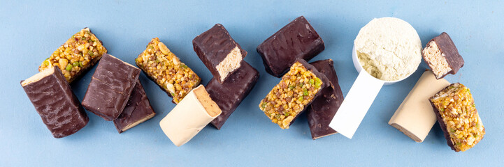 Set of various energy protein bar. Different taste of protein bars and snacks, with protein protein whey powder scoop
