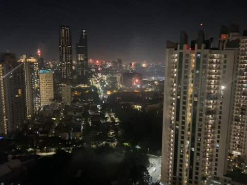 New Year's Eve celebration in Kemayoran Jakarta with beautiful lights from high-rise buildings and fireworks at night