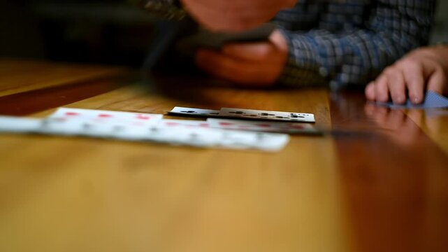 Cinematic close-up stock videos that bring the world of card games to life.  Expertly shot with attention to detail, these clips feature dramatic lighting and smooth camera movements.