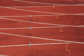  Athlete running track with number on the start . Perspective wide angle